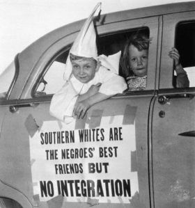 Child in Klan costume at segregationist rally 1956